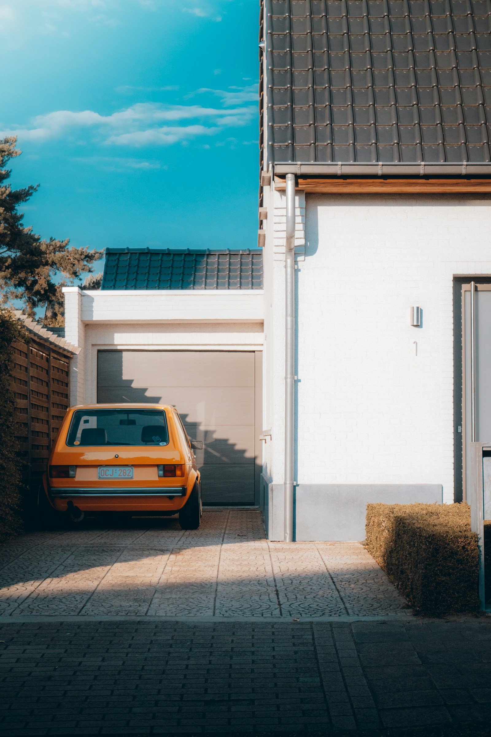 Modern grey sectional garage door on a Melbourne-style home